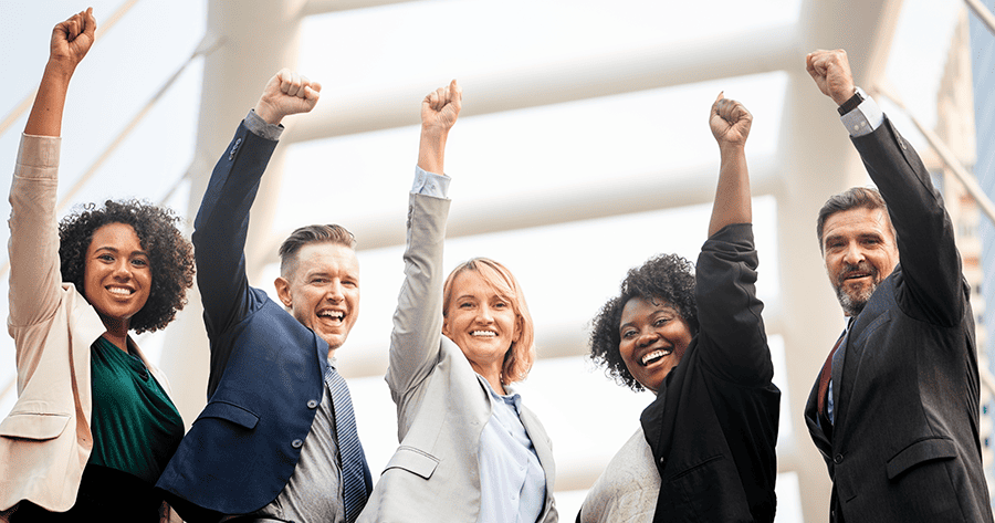 5 happy people of different races raising their arms like their ready for success